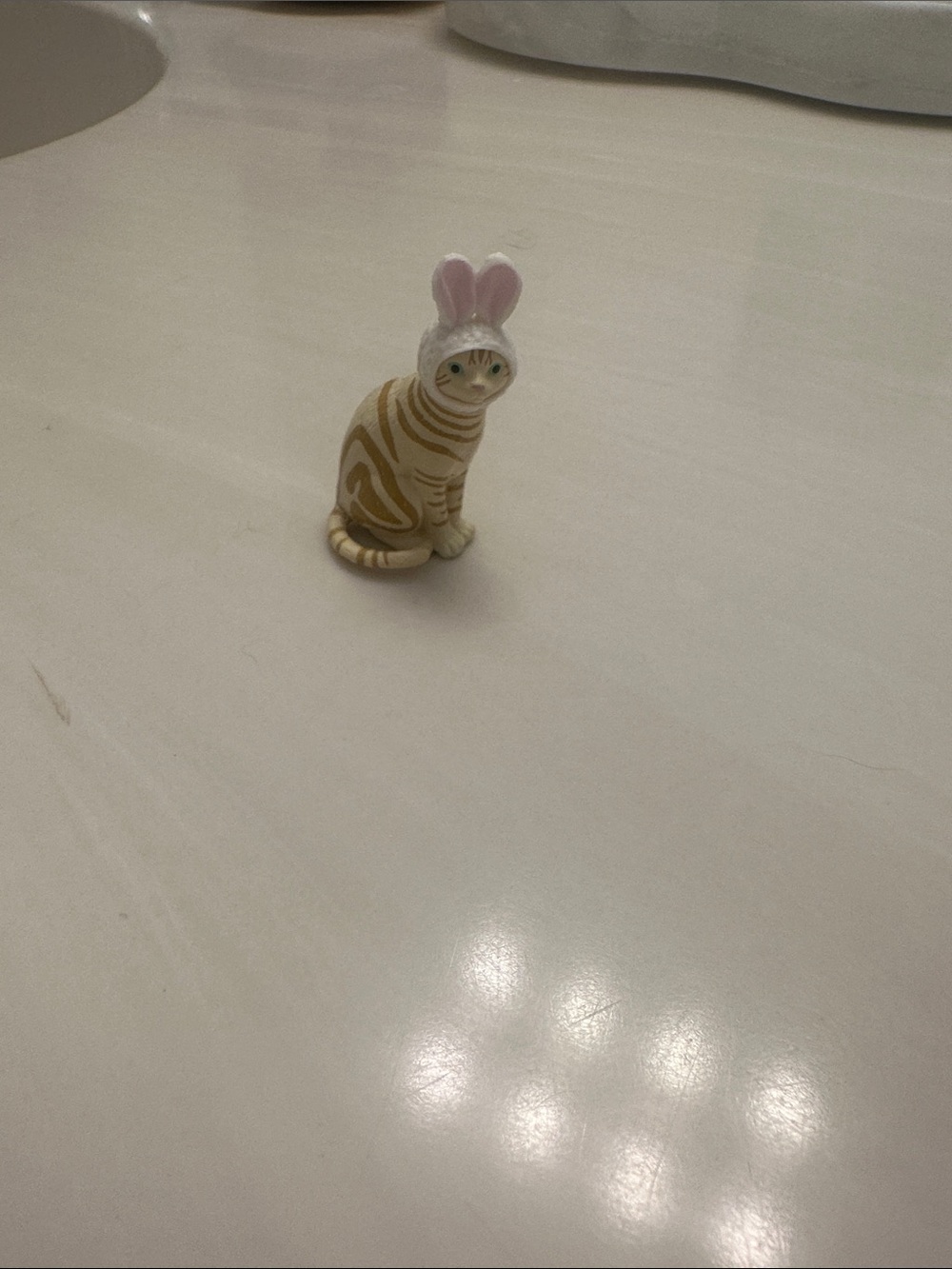 Striped Beige Cat Figurine Toy with Pink Bunny Ears